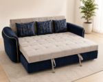 Modern convertible sofa bed with deep tufted seat and pull-out bed mechanism, upholstered in beige and navy-blue velvet fabric.