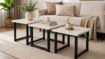 Modern living room featuring Nordic Trio Nesting Tables styled with books, vase, and coffee cup.